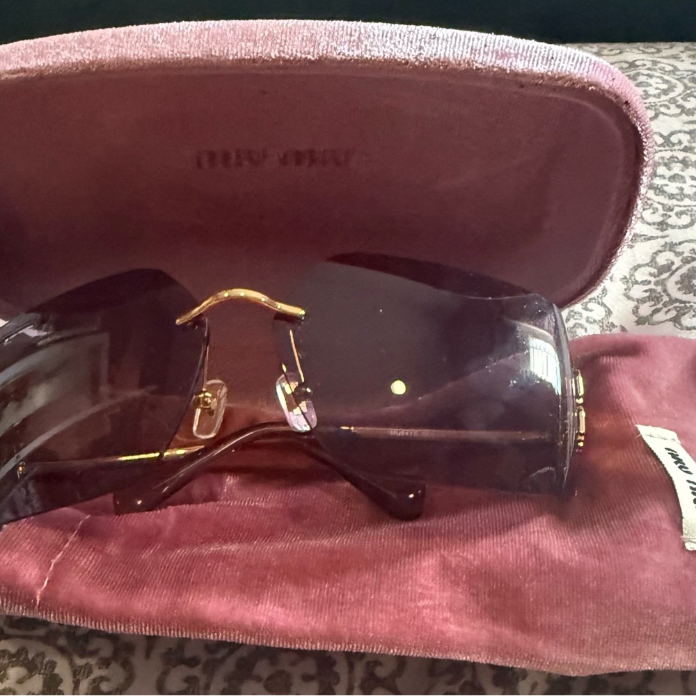 Miu Miu Oversized Rimless Sunglasses with Purple Tint and Gold Accents